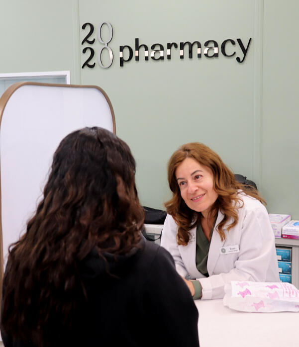 Pharamacist talking to her patient