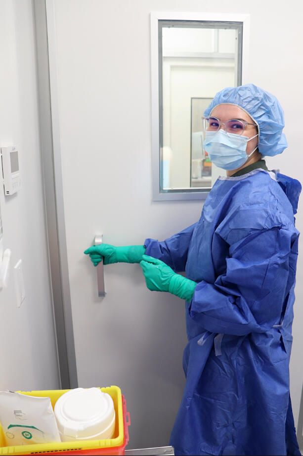 A woman taking prescription delivery from her door